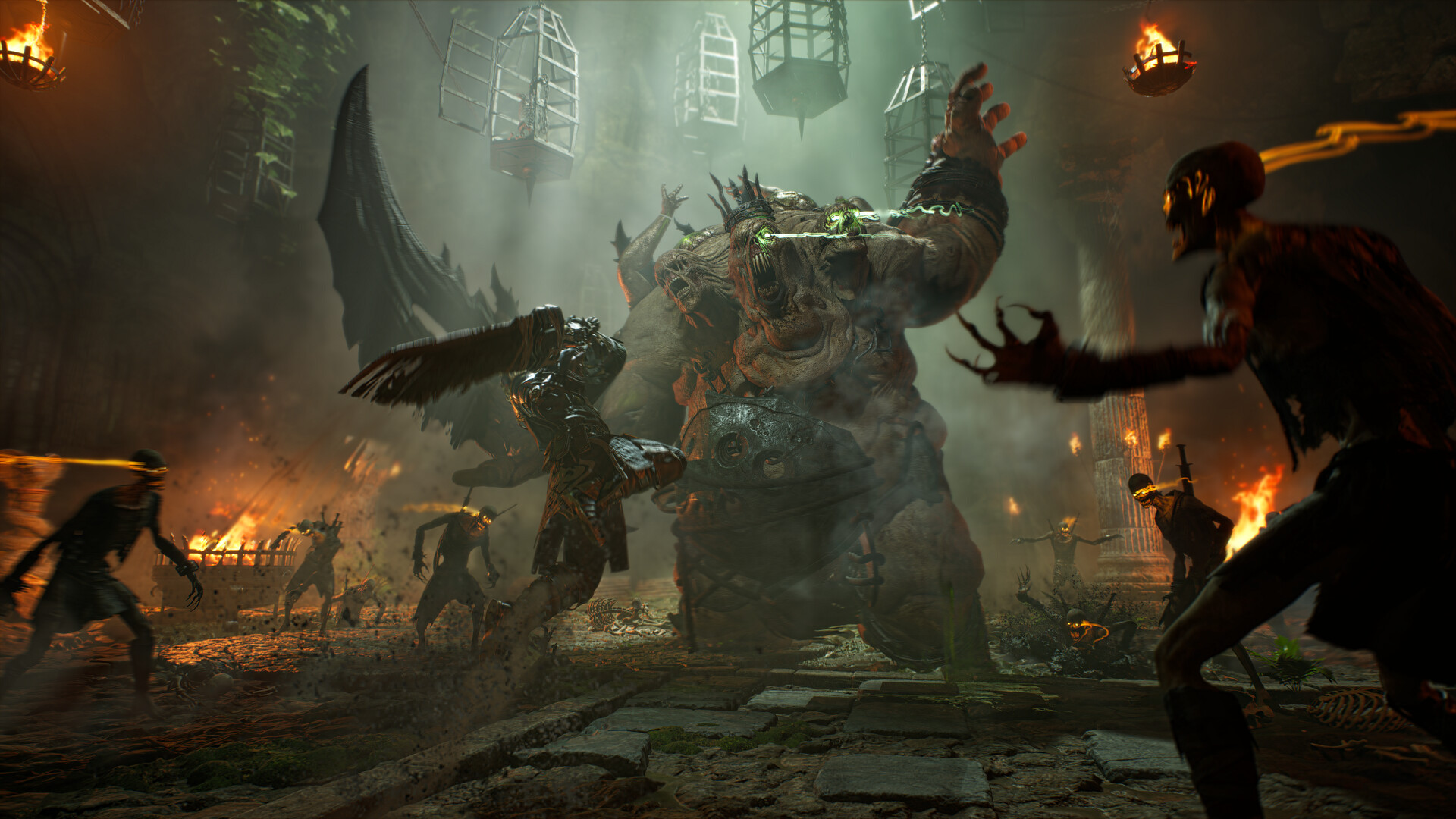 Players surrounding a many-armed creature in a green-lit ruined facility